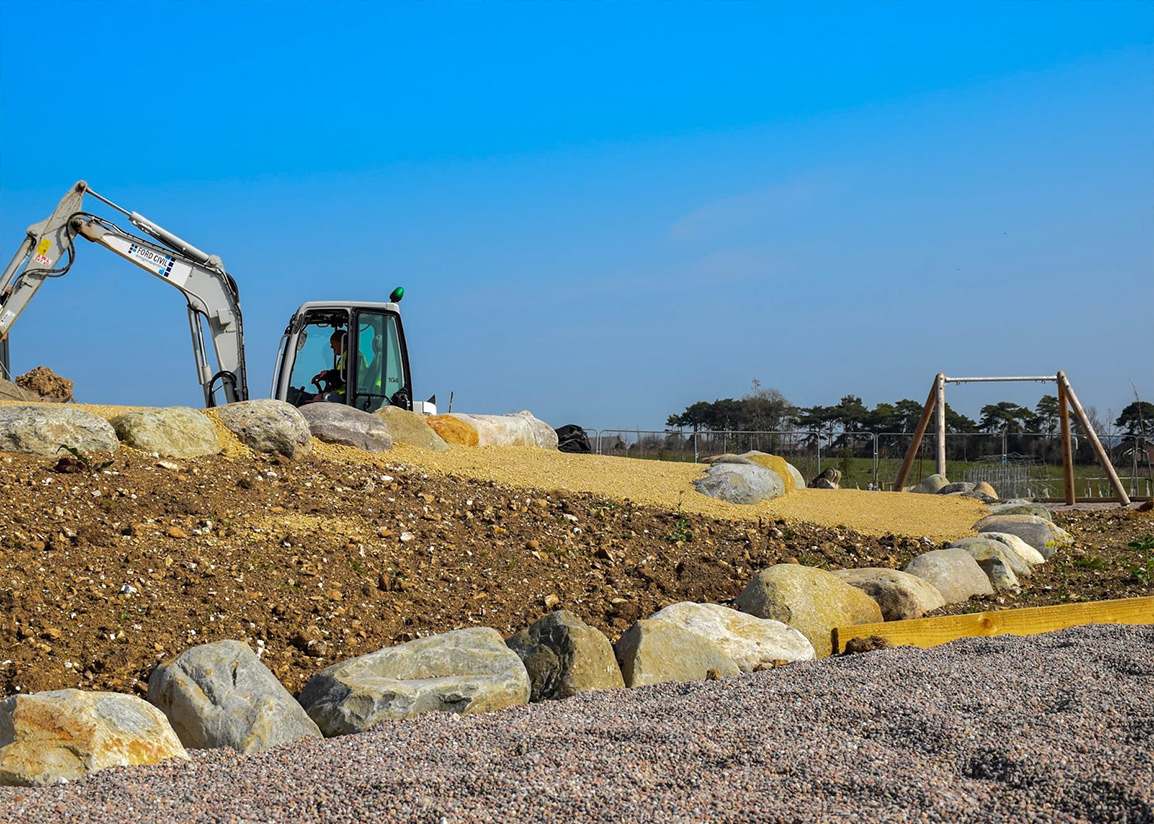 A digger working on civil engineering groundworks.