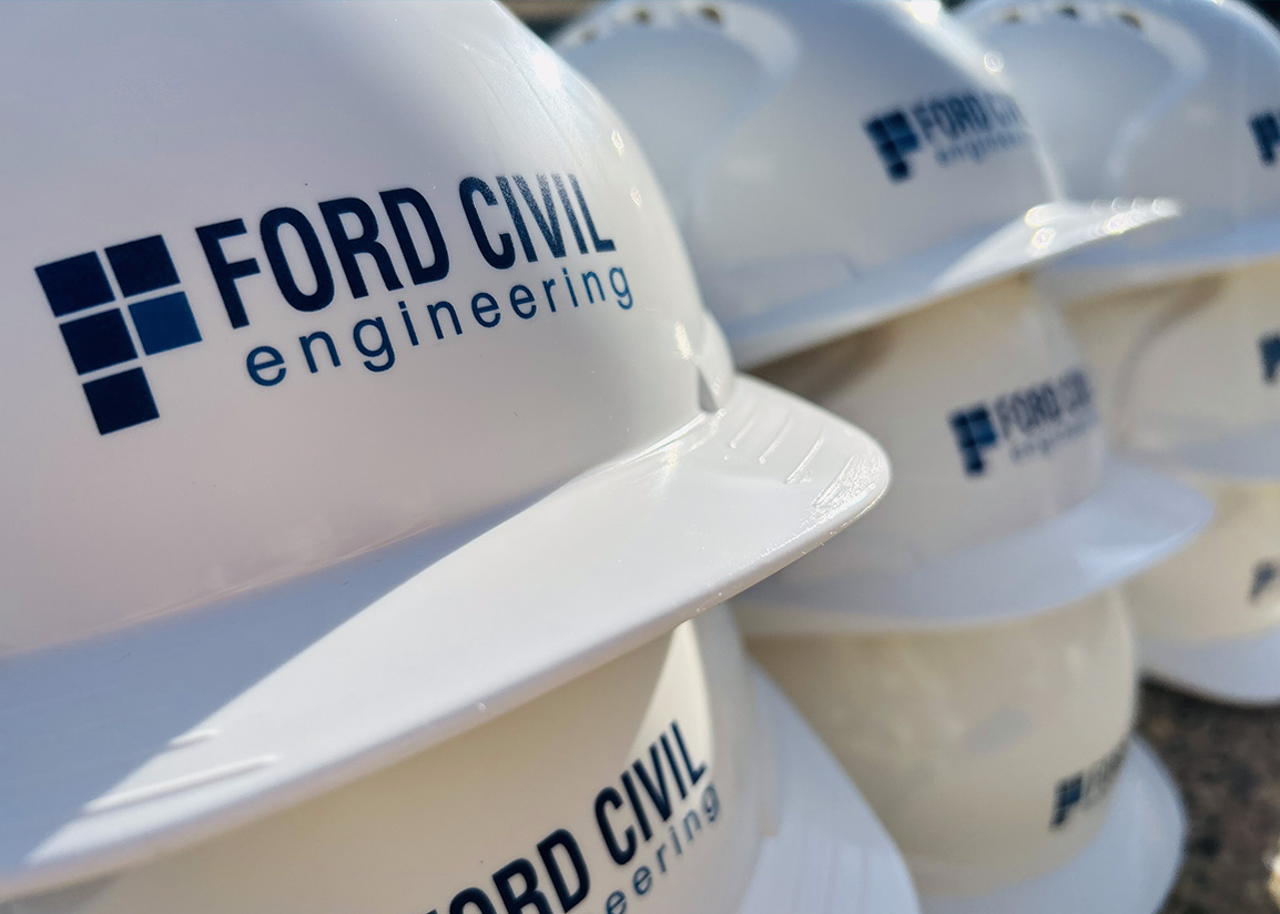 A stack of white hard hats.